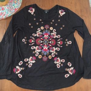 Black long sleeve. Stitched pattern in the front. Sheer back. Size large.